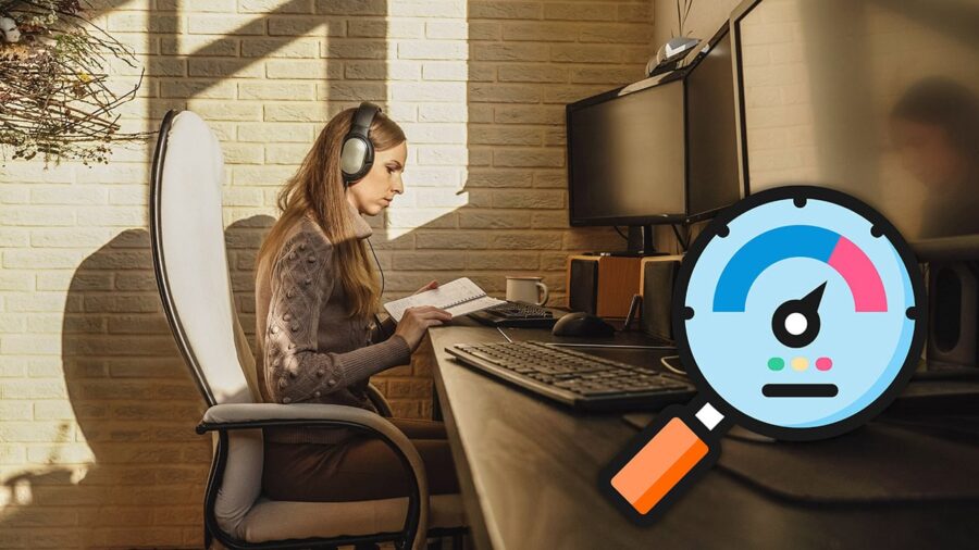 A woman is working remotely at a computer desk with an optimization gauge placed in the corner.